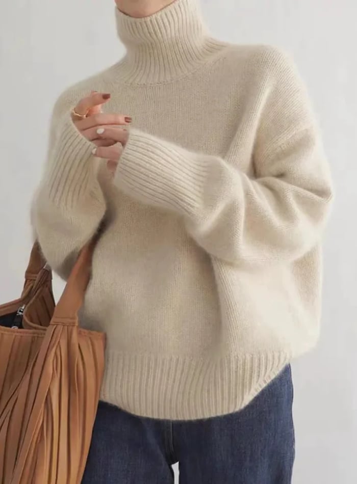 Close-up of the turtleneck sweater fabric texture highlighting its softness and quality