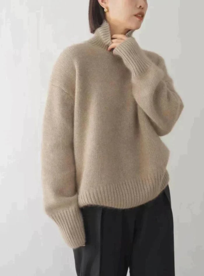 Side view of the soft turtleneck sweater showing sleeve length and shoulder fit