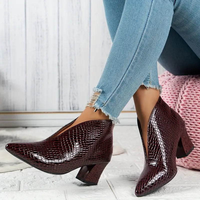 Women's burgundy textured ankle boots with mid block heel, side profile view