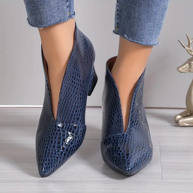 Royal blue textured ankle boots with curved cut, front three-quarter view