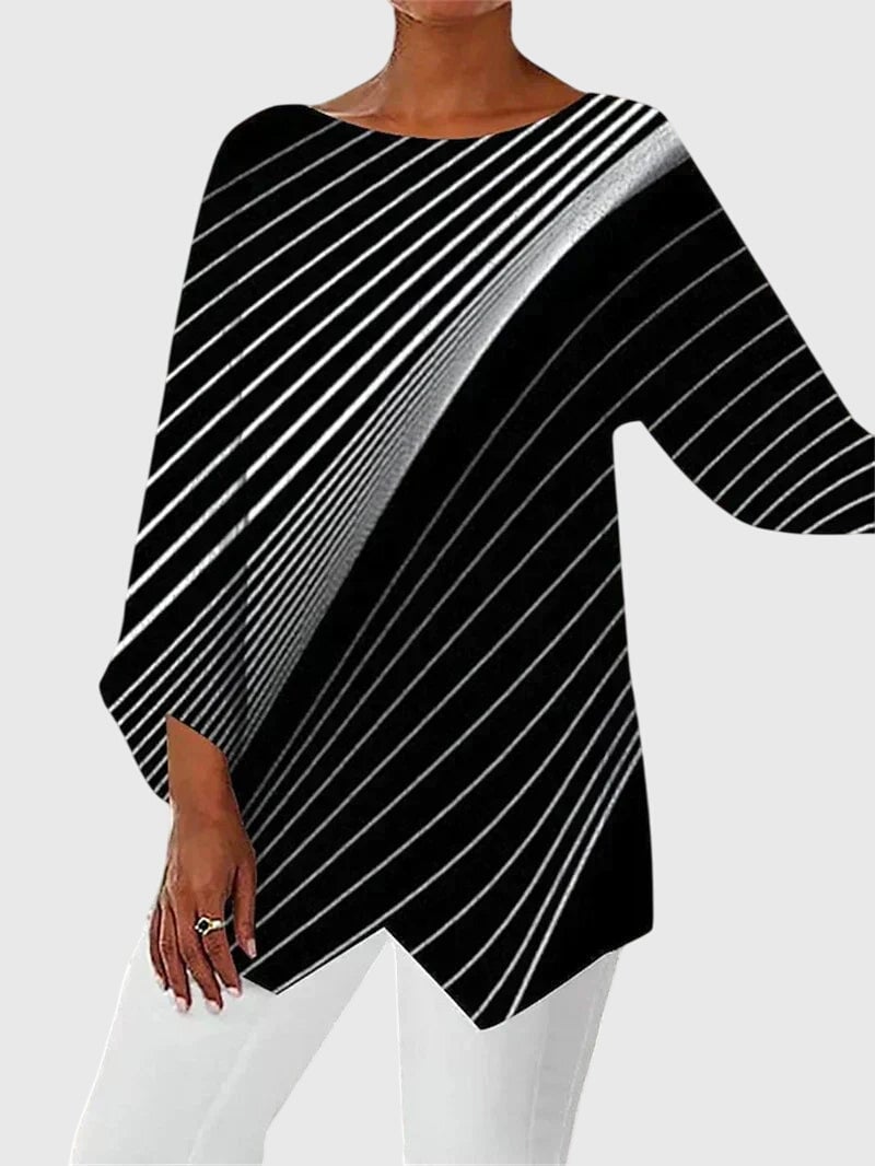 Side view showing asymmetric hem detail on women's butterfly print top