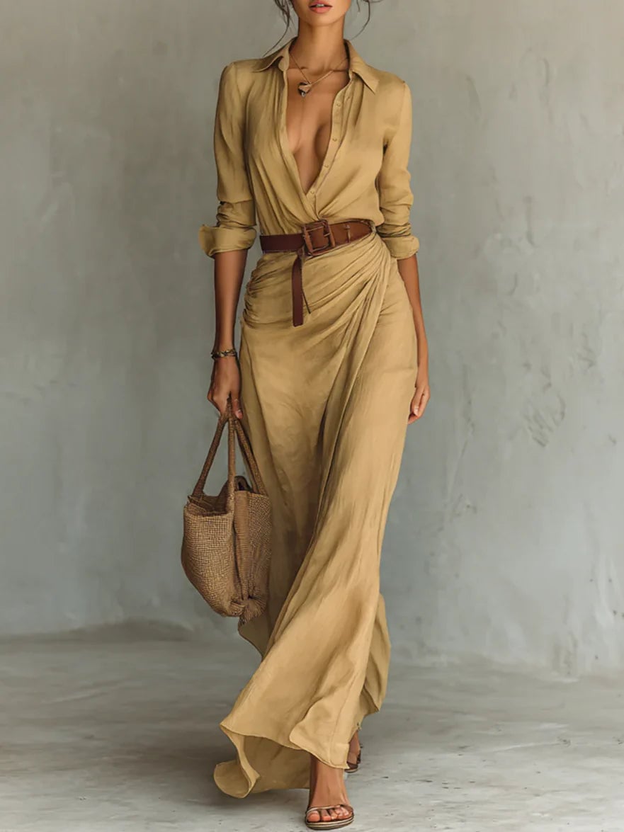 Model wearing a brown belted lapel long sleeve maxi dress with a flowing silhouette, front view
