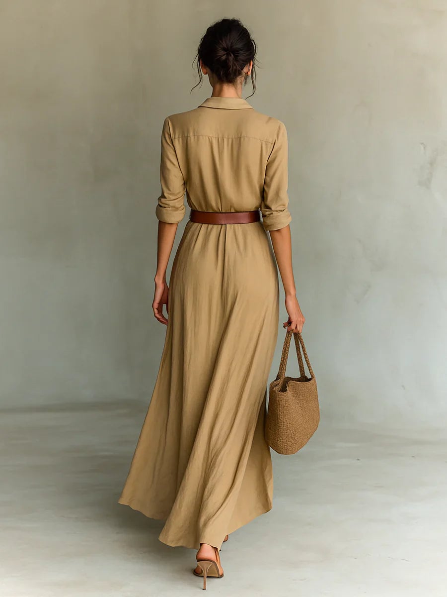 Side view of the belted lapel maxi dress showing the elegant long sleeve and maxi-length silhouette