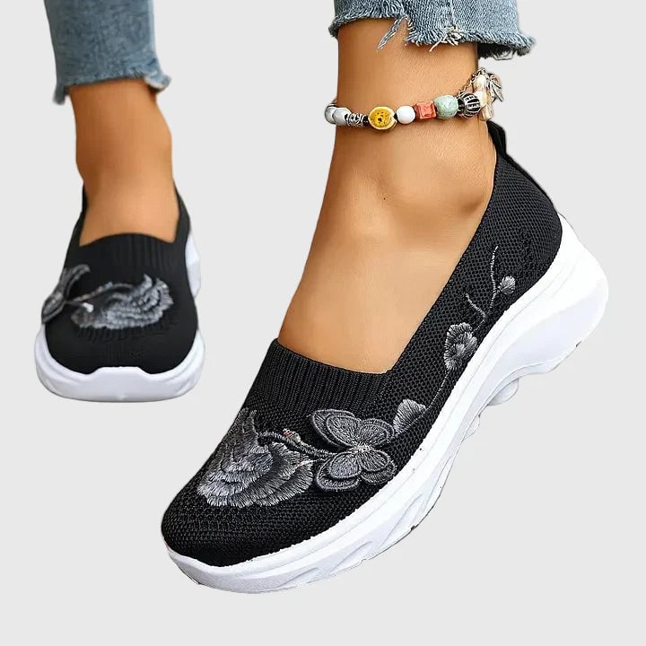 Lydia butterfly embroidered slip-on sneakers in black with breathable mesh upper and delicate embroidery detail