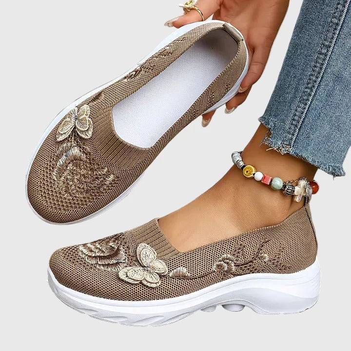 Top-down view of Lydia butterfly embroidered sneakers in khaki highlighting intricate embroidery pattern