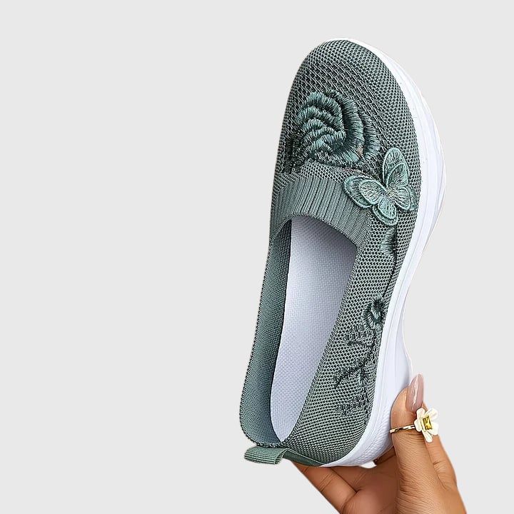 Close-up of butterfly embroidery detail on Lydia mesh sneakers