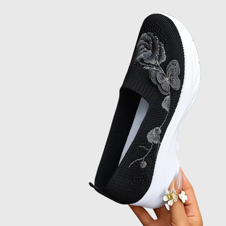 Lydia sneakers styled with casual outfit showing slip-on design and feminine detailing