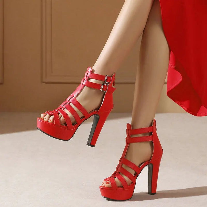 Lynette wide-fit leather platform flat sandals in red shown from the front angle