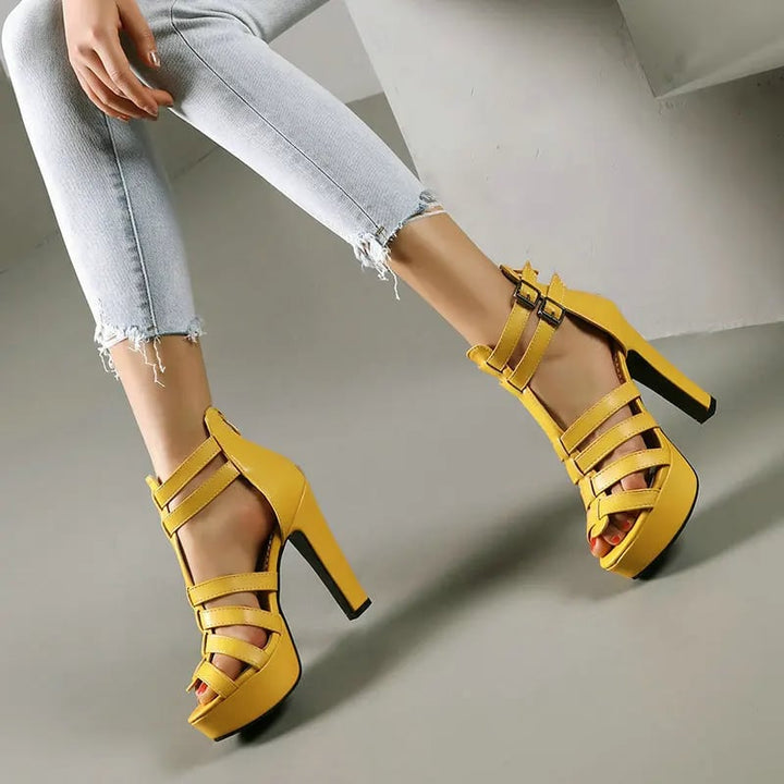 Lynette leather platform sandals styled with a floral midi dress on a model