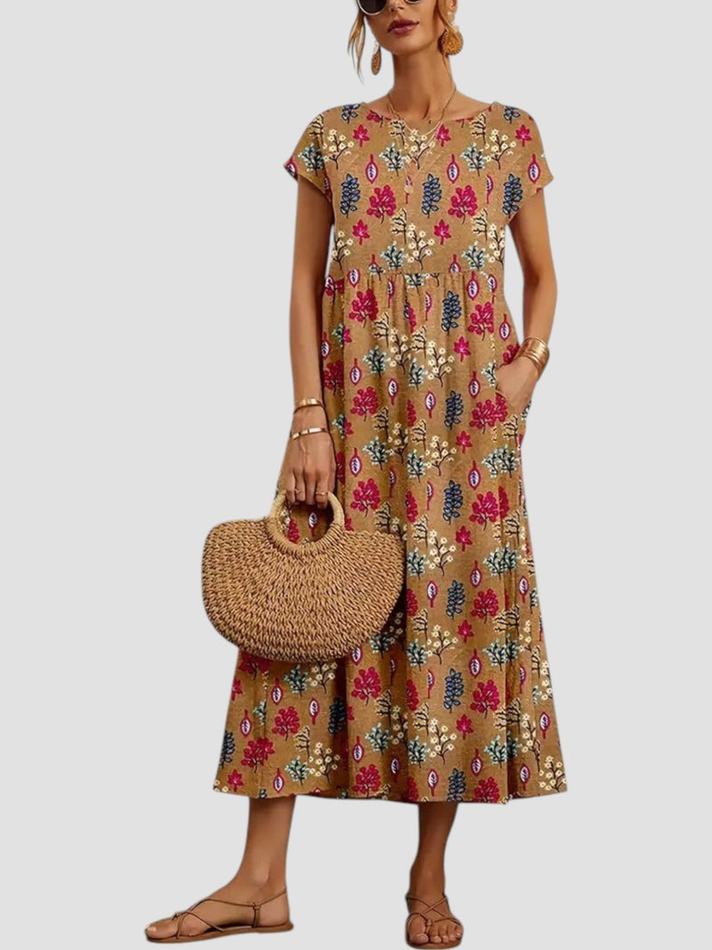 Full-length view of a model in a red vintage floral maxi dress showing the flowing silhouette