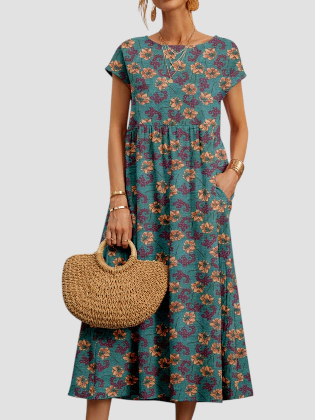 Side view of a woman in a blue floral maxi dress highlighting the relaxed, flattering fit