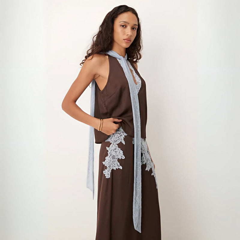 Side view of the brown lace panel coordinated top and skirt set highlighting the flattering silhouette and hem lace trim