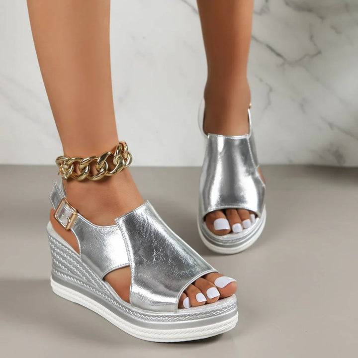 Mabel women's adjustable sandal in gold shown from the side highlighting strap detail