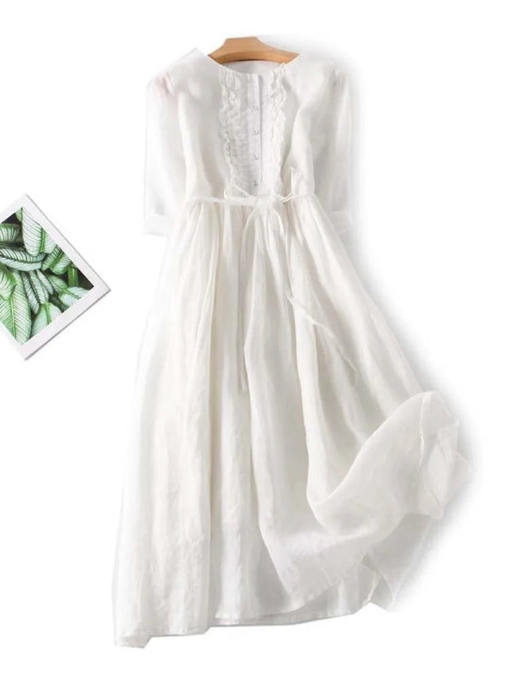 Flat lay of the Madeleine vintage-inspired dress in pink and white color options