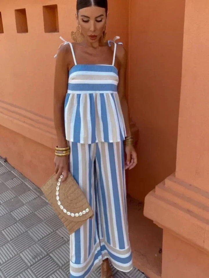 Front view of the Madeleine women's wedding guest two-piece ensemble in Blue showing the flowy top and coordinating trousers