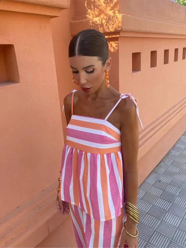 Side profile of the Madeleine ensemble in Pink showing the flattering easy-fit trousers and feminine silhouette