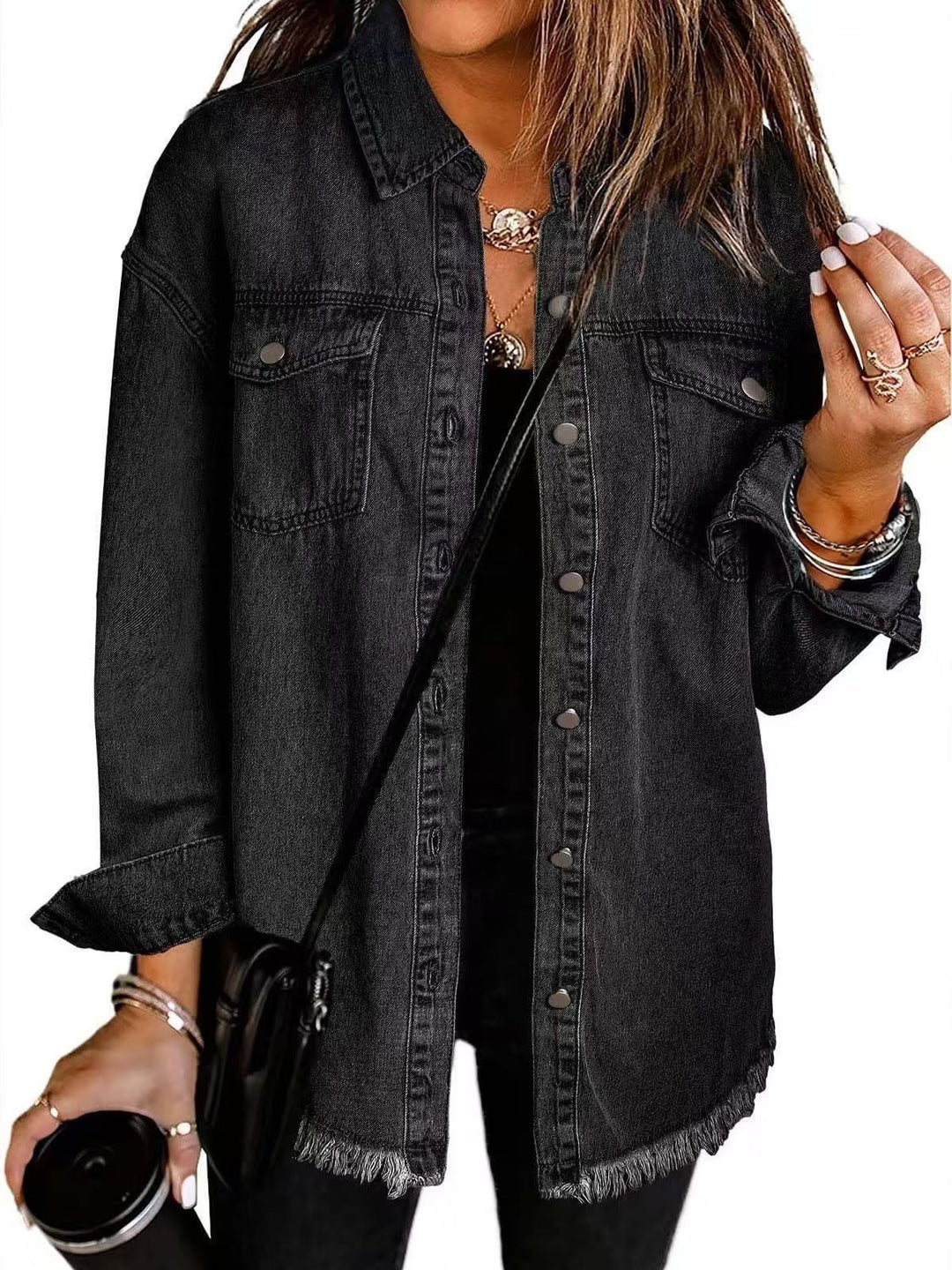 Woman wearing a classic everyday denim jacket in a relaxed oversized fit, styled casually
