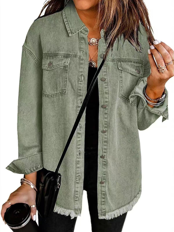 Close-up detail of denim jacket stitching and button hardware