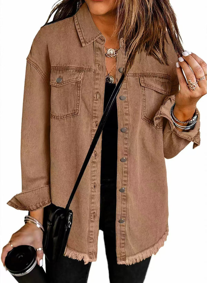 Denim jacket laid flat showing full silhouette and sleeve length