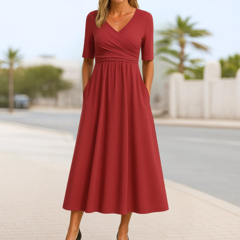 Front view of the Madeline crossed short-sleeve dress highlighting the draped bodice and feminine neckline