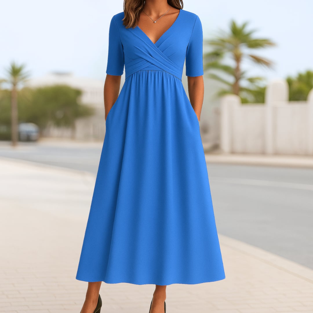 Full-length view of the Madeline crossed dress in light blue, perfect for casual daytime wear