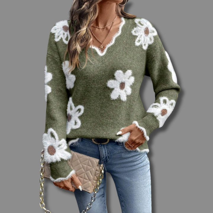 Close-up of the Madeline flower sweater showing delicate floral detailing on a soft knit fabric