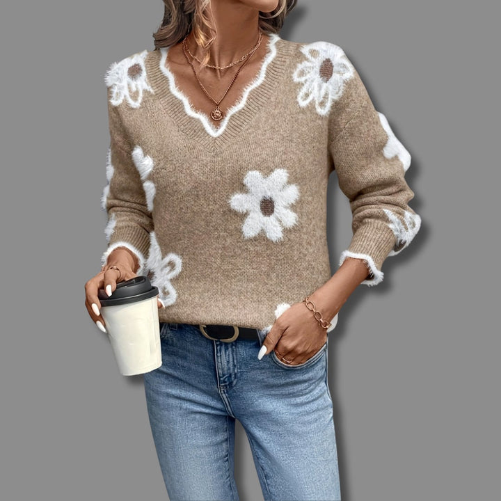 Model styling the Madeline sweater in light blue paired with casual trousers