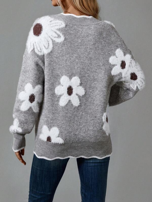 Woman wearing the Madeline sweater in green with a feminine, relaxed everyday look