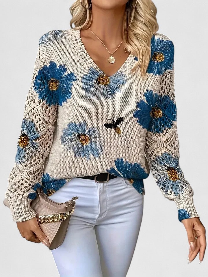 Woman wearing an elegant lightweight floral sweater in blue with a soft feminine pattern