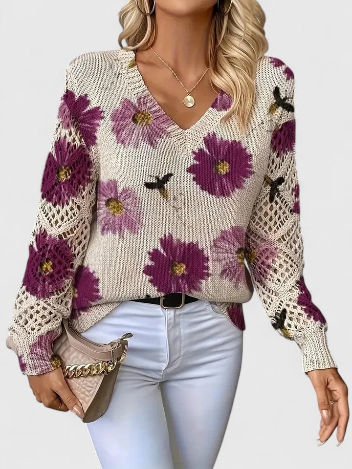 Side view of elegant floral sweater in green on a female model