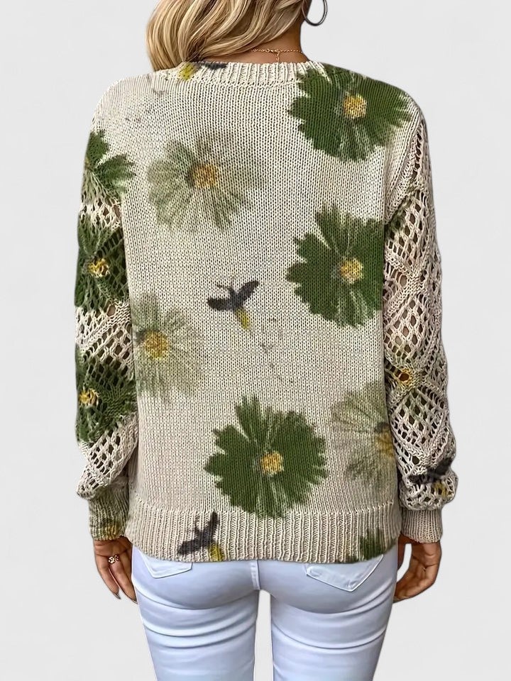 Women's floral sweater size chart showing bust, sleeve, shoulder, length, and hem measurements