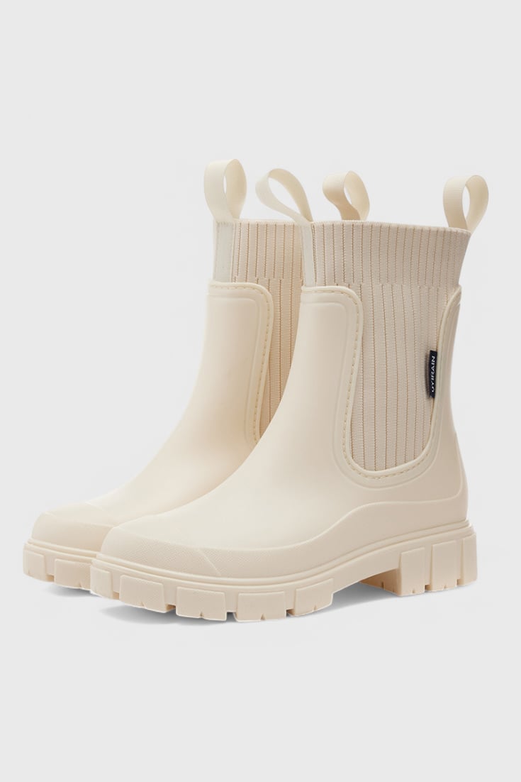 Maelie waterproof Chelsea boots in a neutral colorway, front three-quarter view showing sleek ankle silhouette