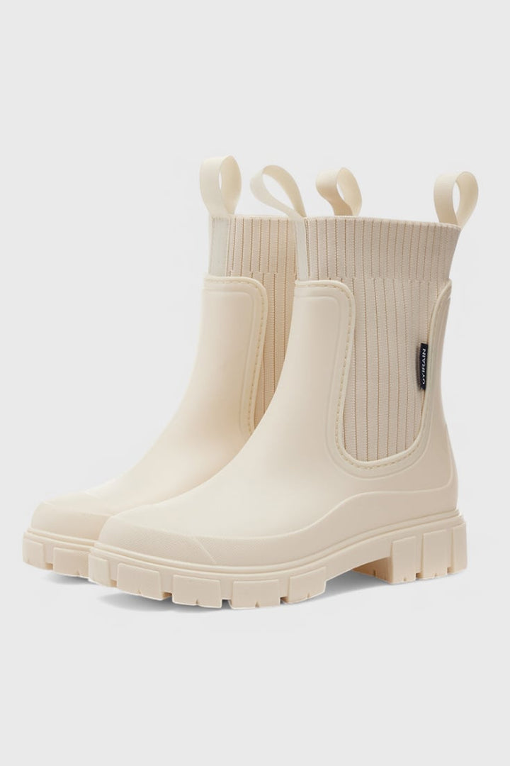 Maelie waterproof Chelsea boots in a neutral colorway, front three-quarter view showing sleek ankle silhouette