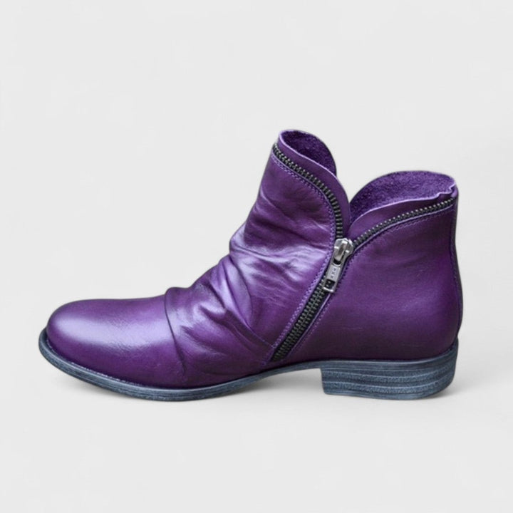 Women's orthopedic boot in a modern silhouette shown from the side, featuring a cushioned interior and supportive sole