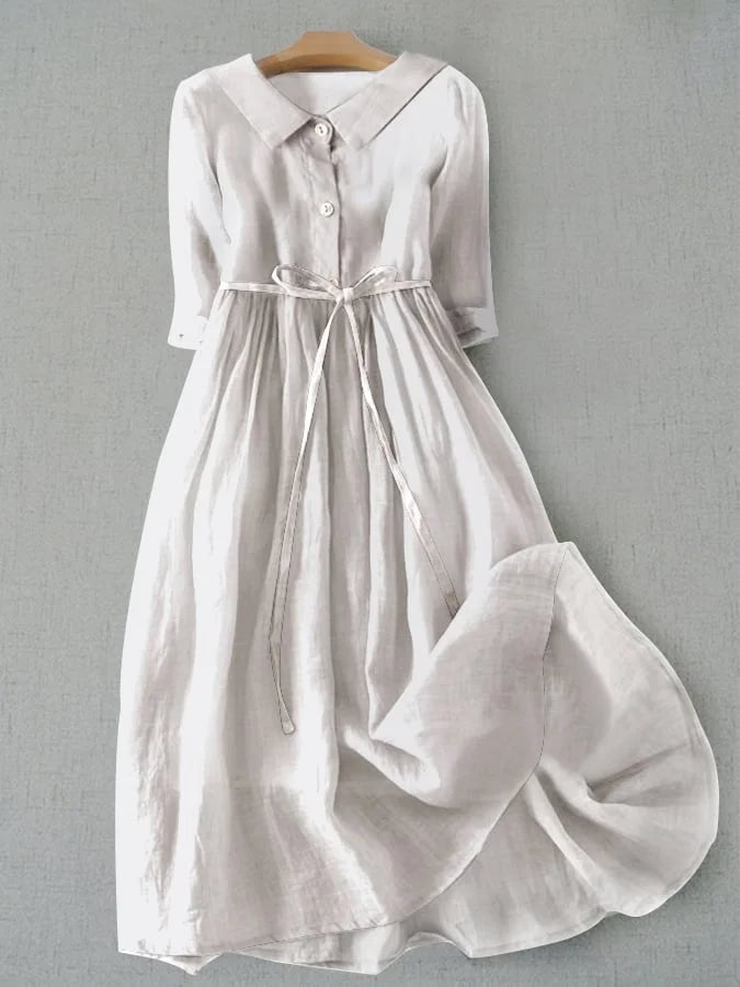 Front view of the Magnolia flowy draped midi dress in white, showing elegant draping and flattering feminine fit