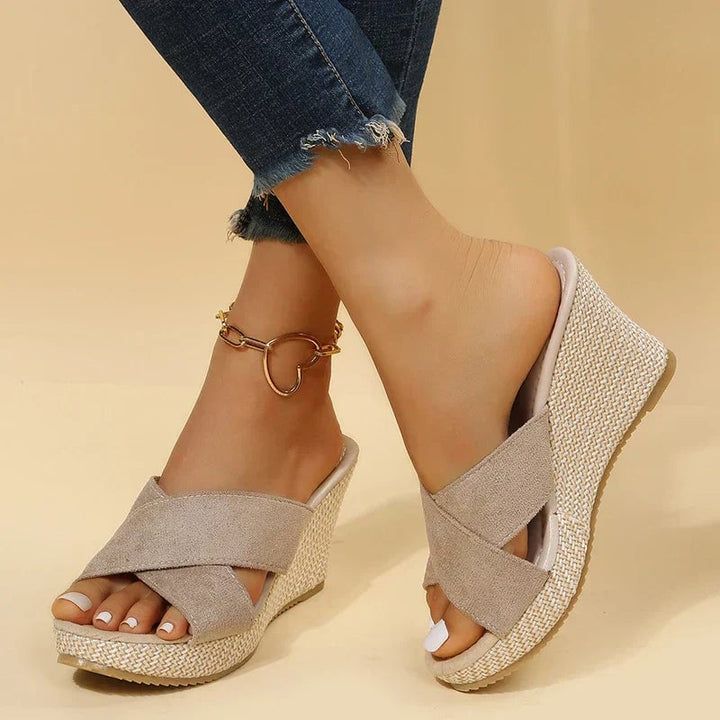 Lifestyle shot of Magnolia women's wedge sandals styled with a summer outfit