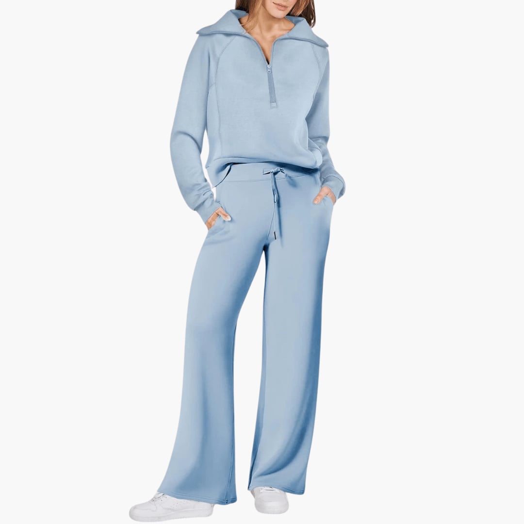 Woman in a gray wide leg lounge set paired with casual sneakers for an everyday look