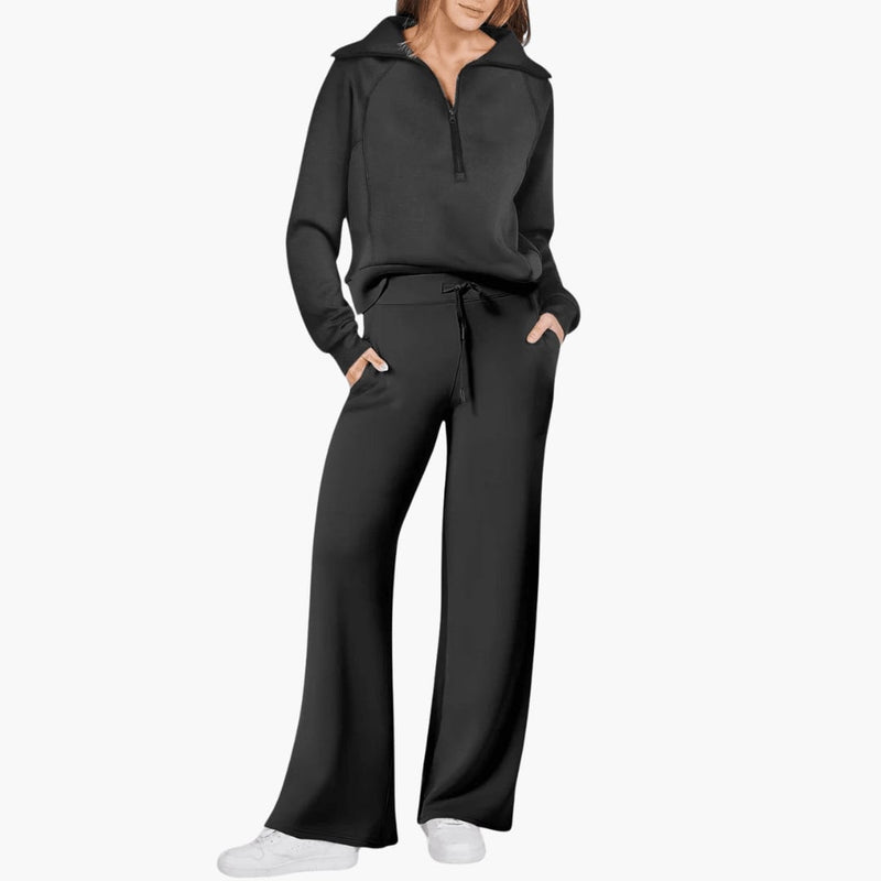 Flat lay of the matching zip-up hoodie and wide leg pants lounge set in black