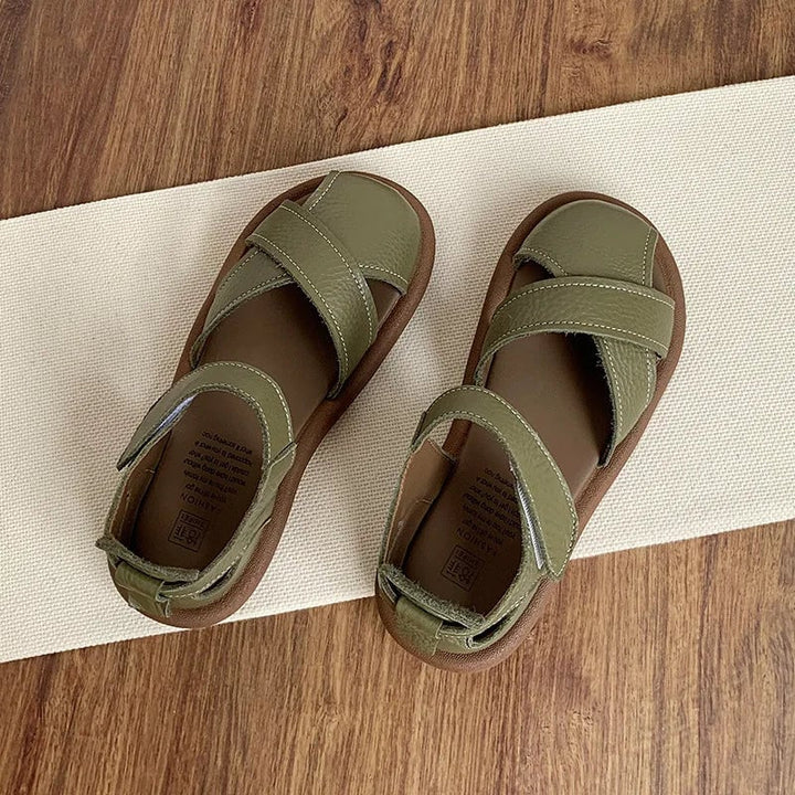 Lifestyle shot of Maisie women's sandals in creamy white worn with casual summer outfit