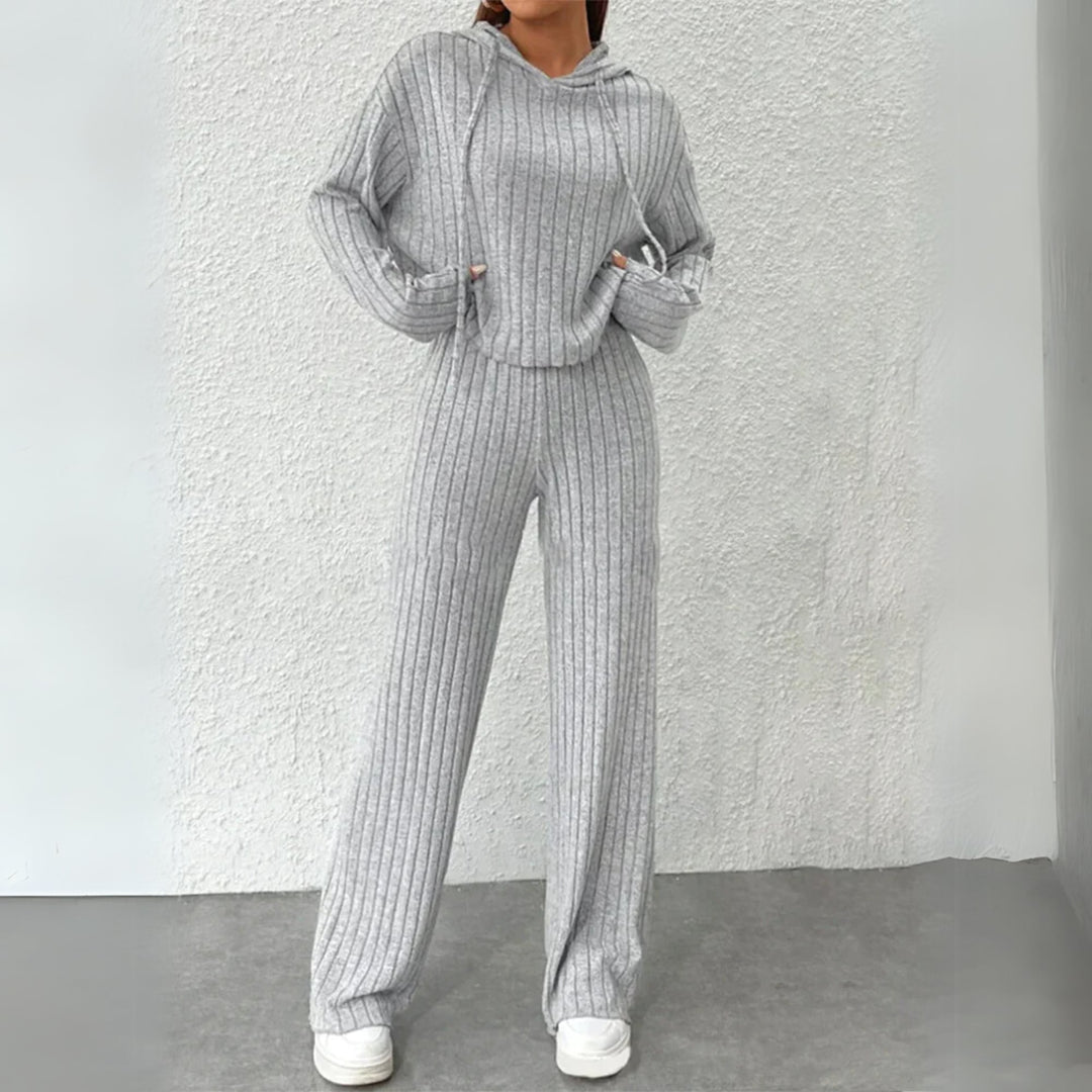 Woman wearing a cozy hooded ribbed knit sweat set in a relaxed fit, styled for casual everyday wear
