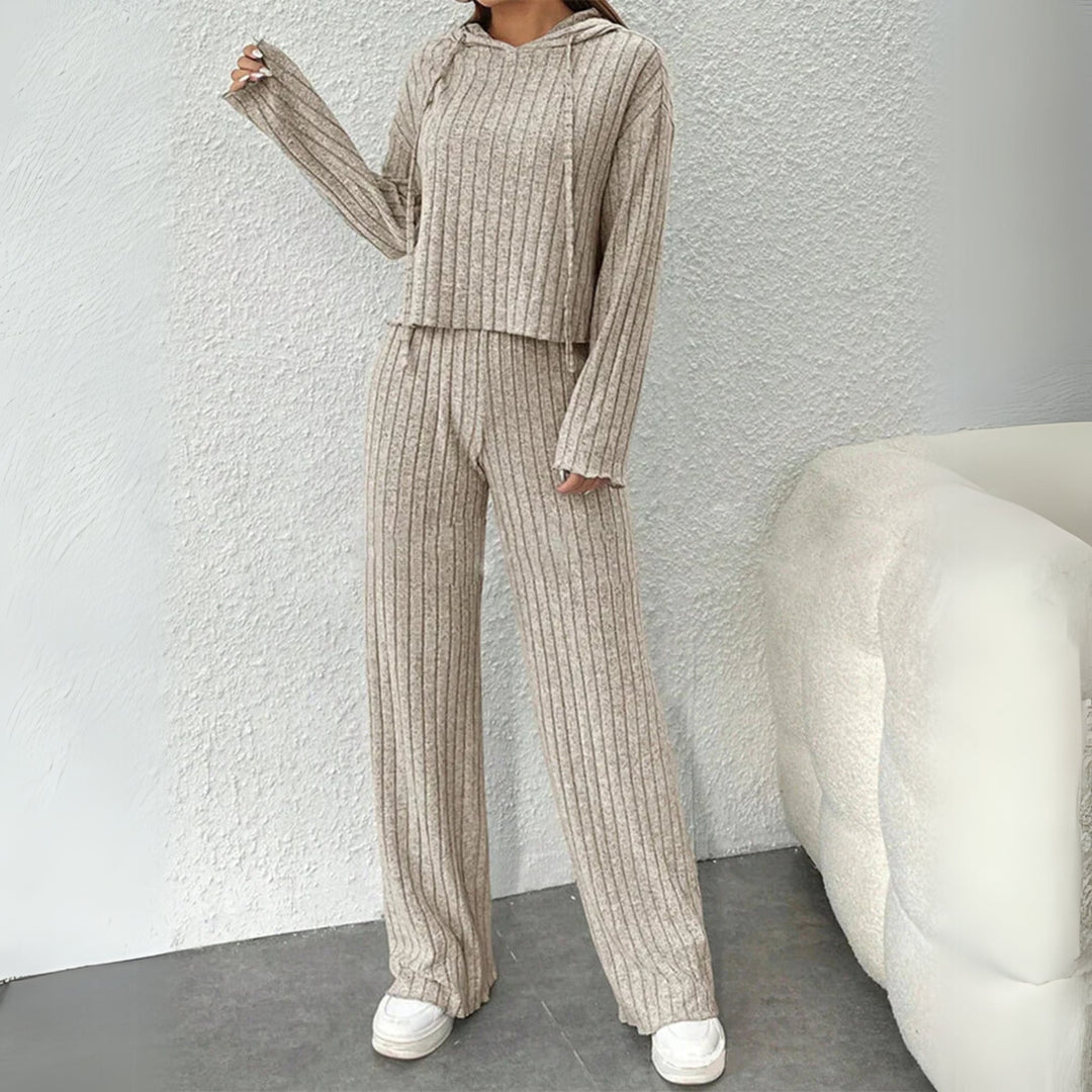 Close-up detail of soft ribbed knit fabric on a hooded sweat set available in grey, beige, and black