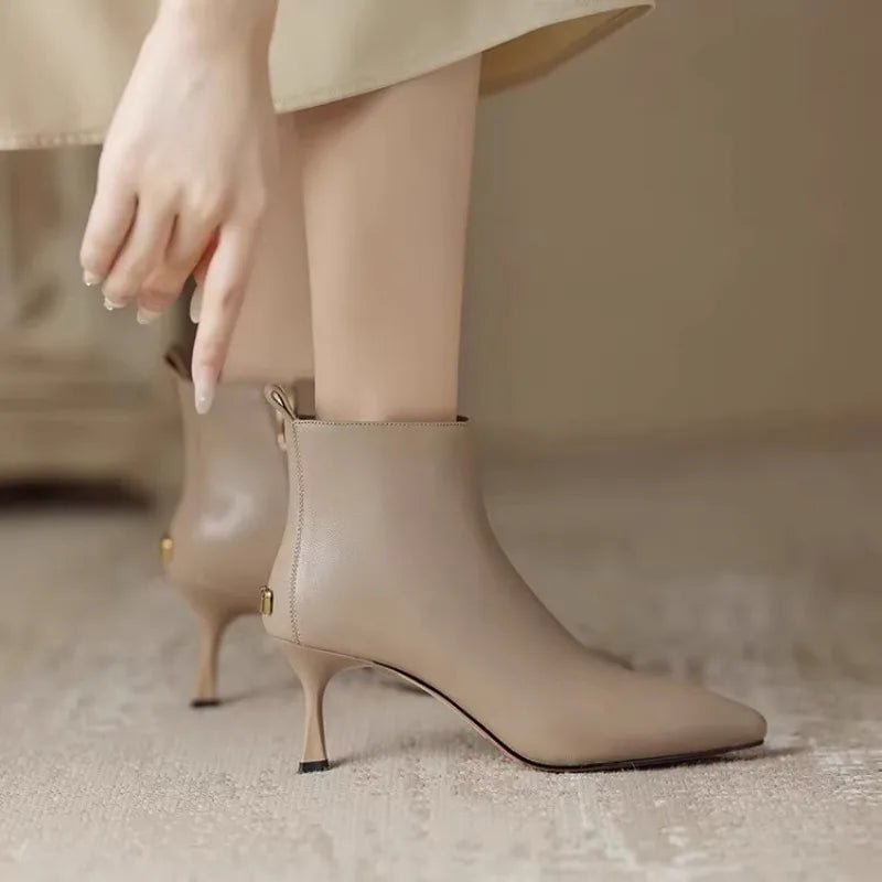 Pair of Maja kitten boots in brown from the back showing heel detail
