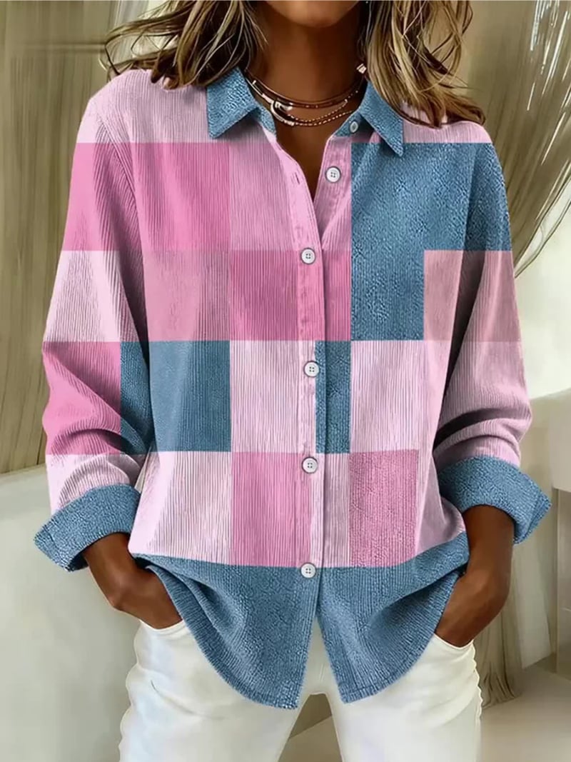 Woman wearing the Mallory Diligent Blouse in a multicolored lightweight fabric with a clean tailored silhouette