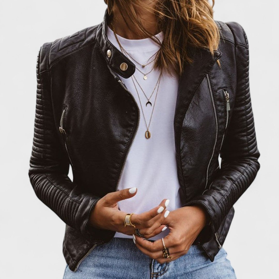 Woman wearing a fitted elegant black jacket with a tailored silhouette, front view