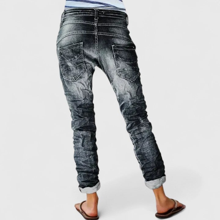 Front view of Marcella distressed wide leg jeans with weathered detailing and cuffed hem