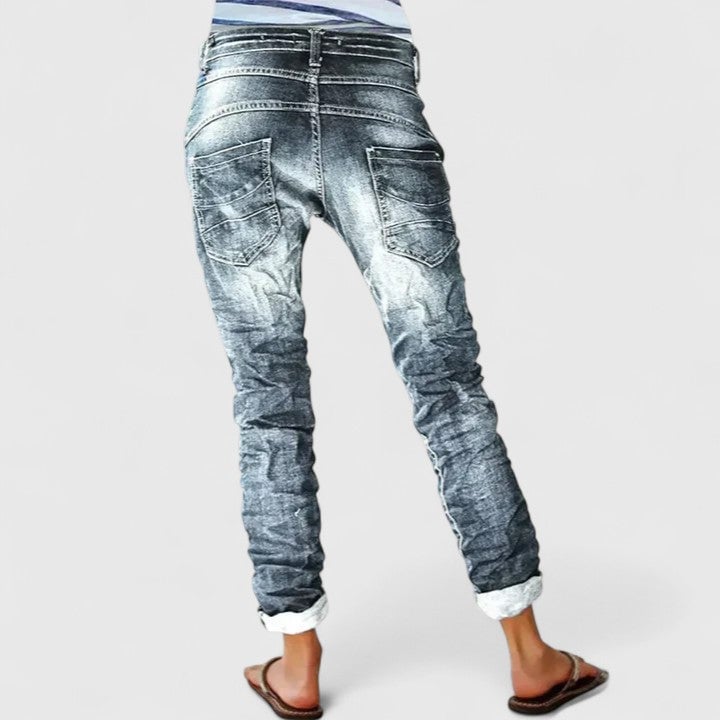 Close-up of distressed detailing and weathered finish on Marcella wide leg jeans