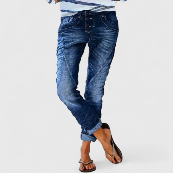 Full-length view of model wearing Marcella distressed wide leg jeans in light blue