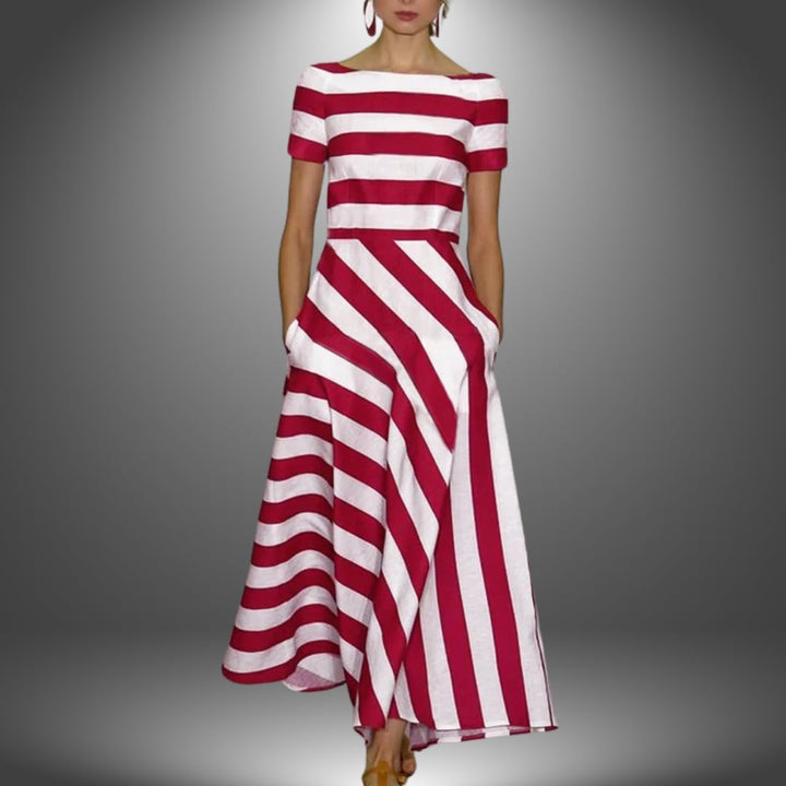 Woman wearing a handcrafted striped maxi dress in red with a relaxed full-length silhouette