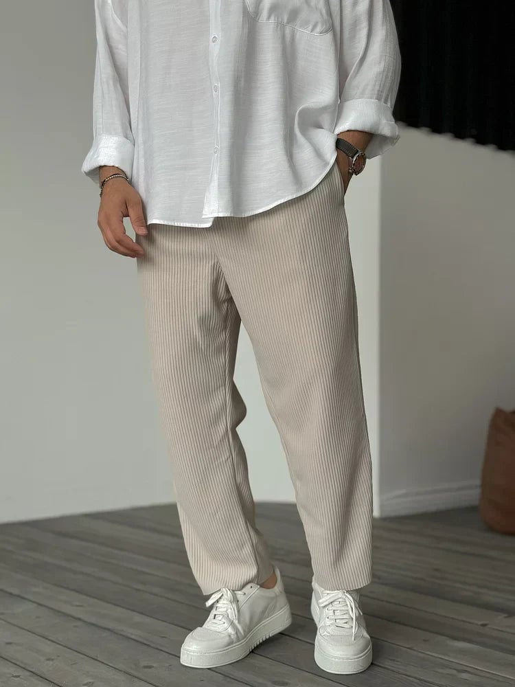 Front view of luxurious soft everyday trousers in a neutral colorway, styled for a polished casual look