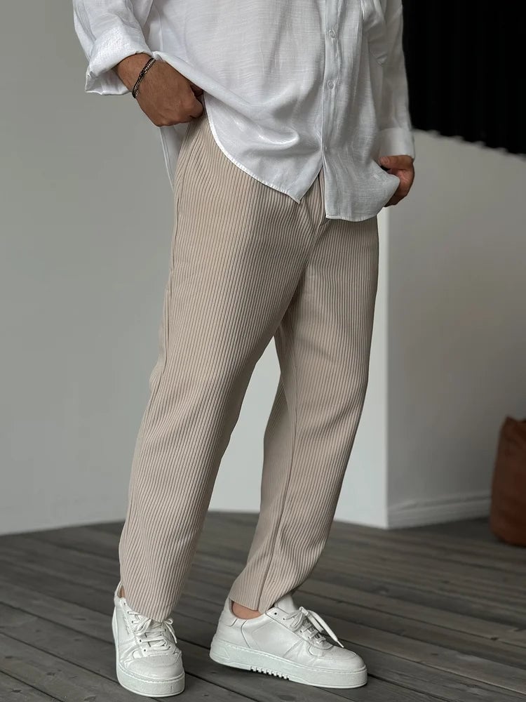 Full-length side view of the everyday trousers highlighting the clean silhouette and relaxed fit